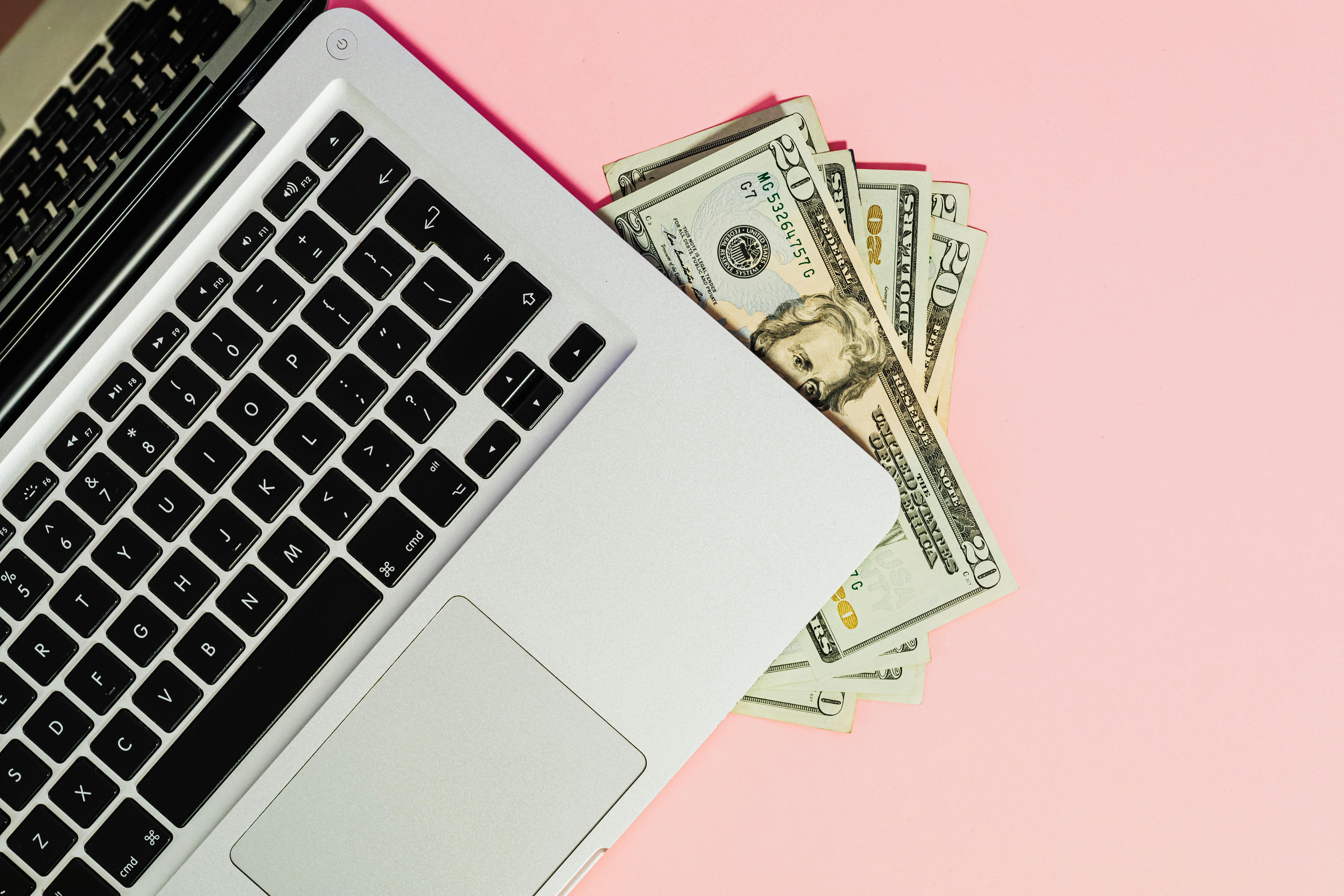 Founder working on laptop with AI tools, building income streams with AI in 2026