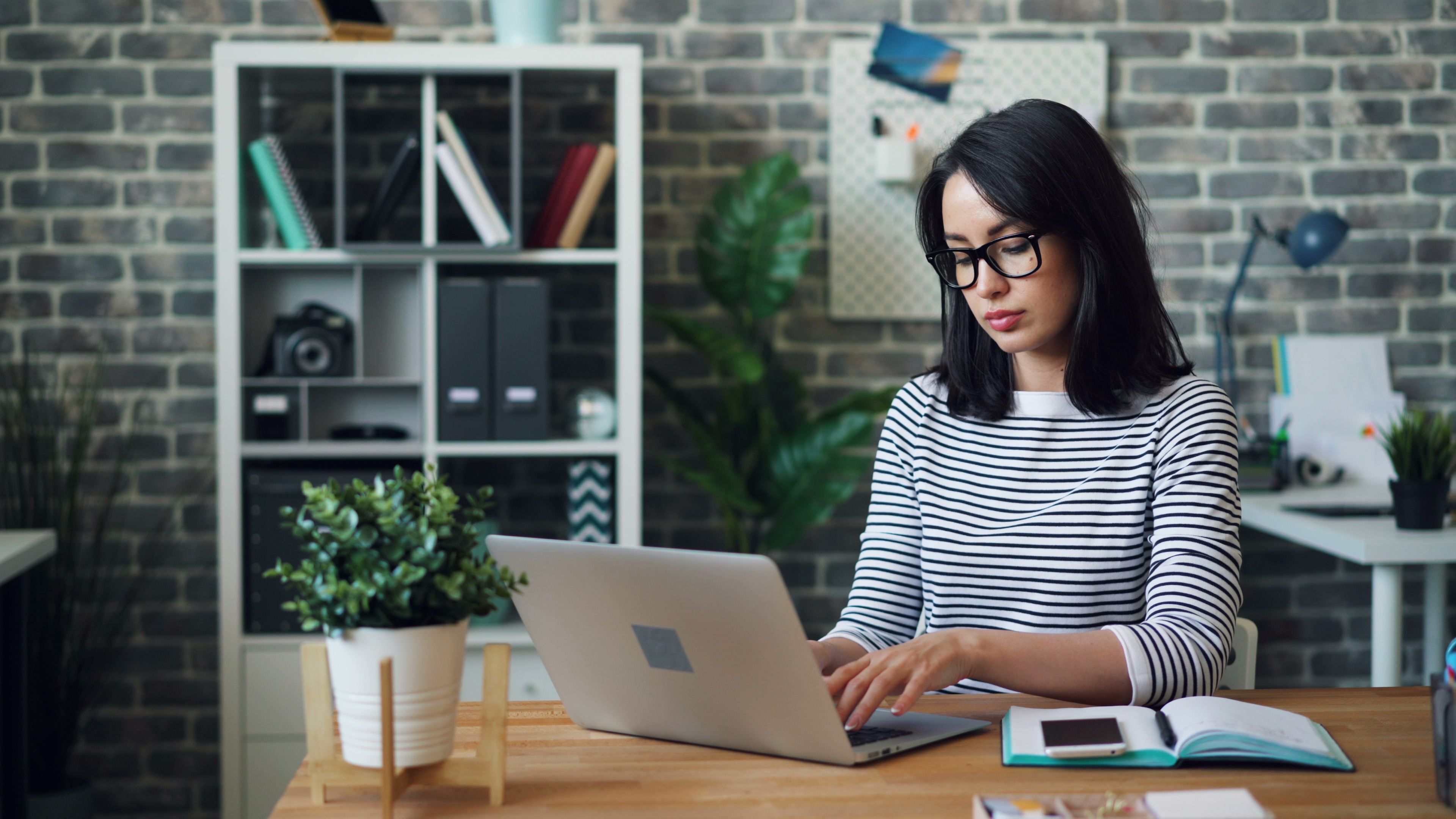 Founder using AI tools on laptop to grow business faster — AI business growth strategy