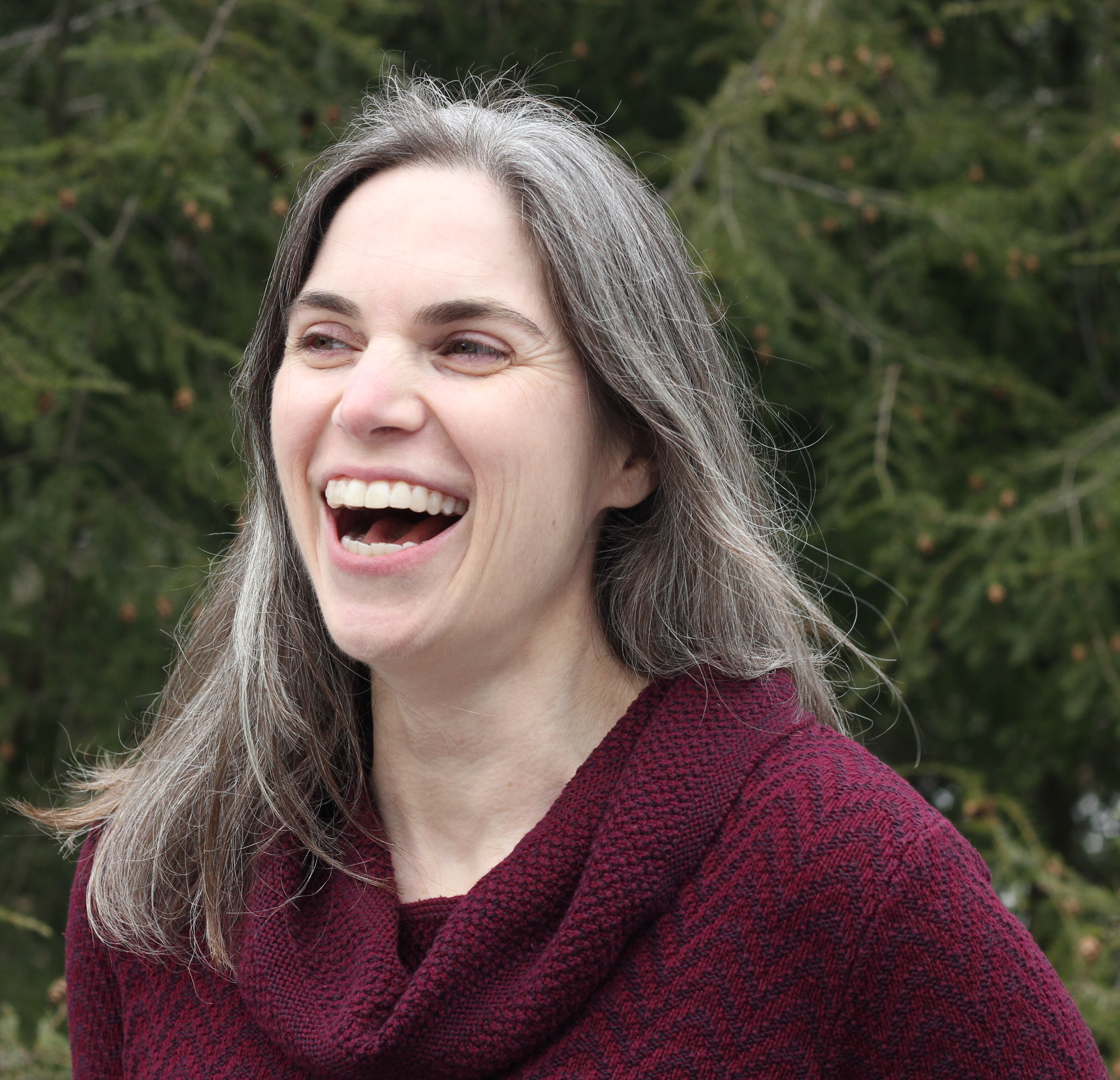 A white woman laughing.