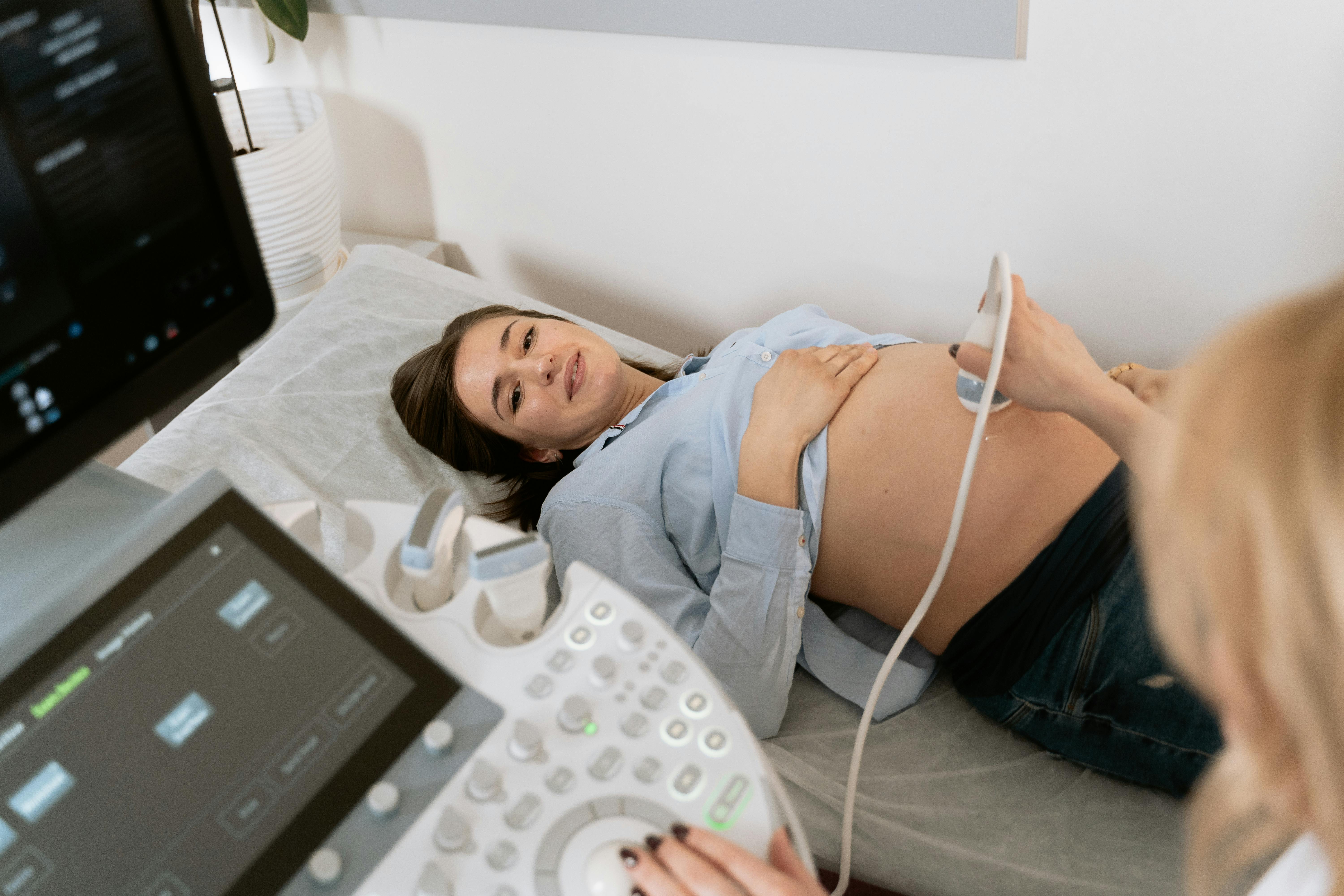 Woman in her Ob-Gyn appointment feeling confident, in trust and happy. 