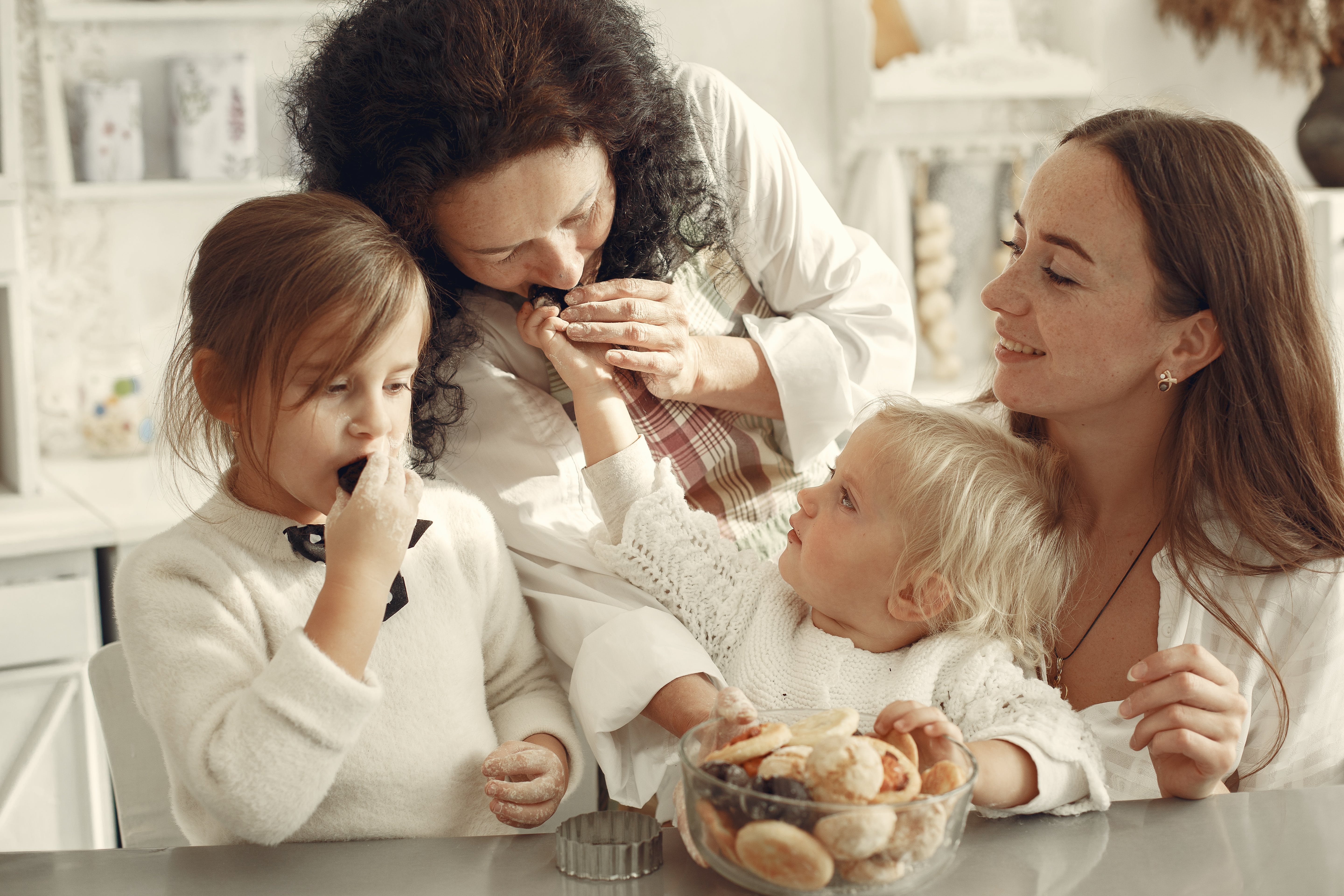 Image of women at different stages of their lifes, nurturing and loving eachother.