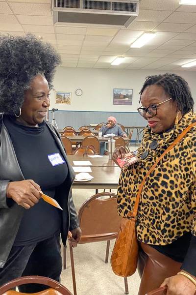 two playce participants sharing responses at a community engagement event