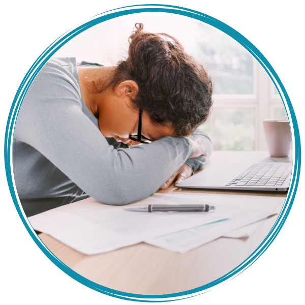 Girl worried, head on desk