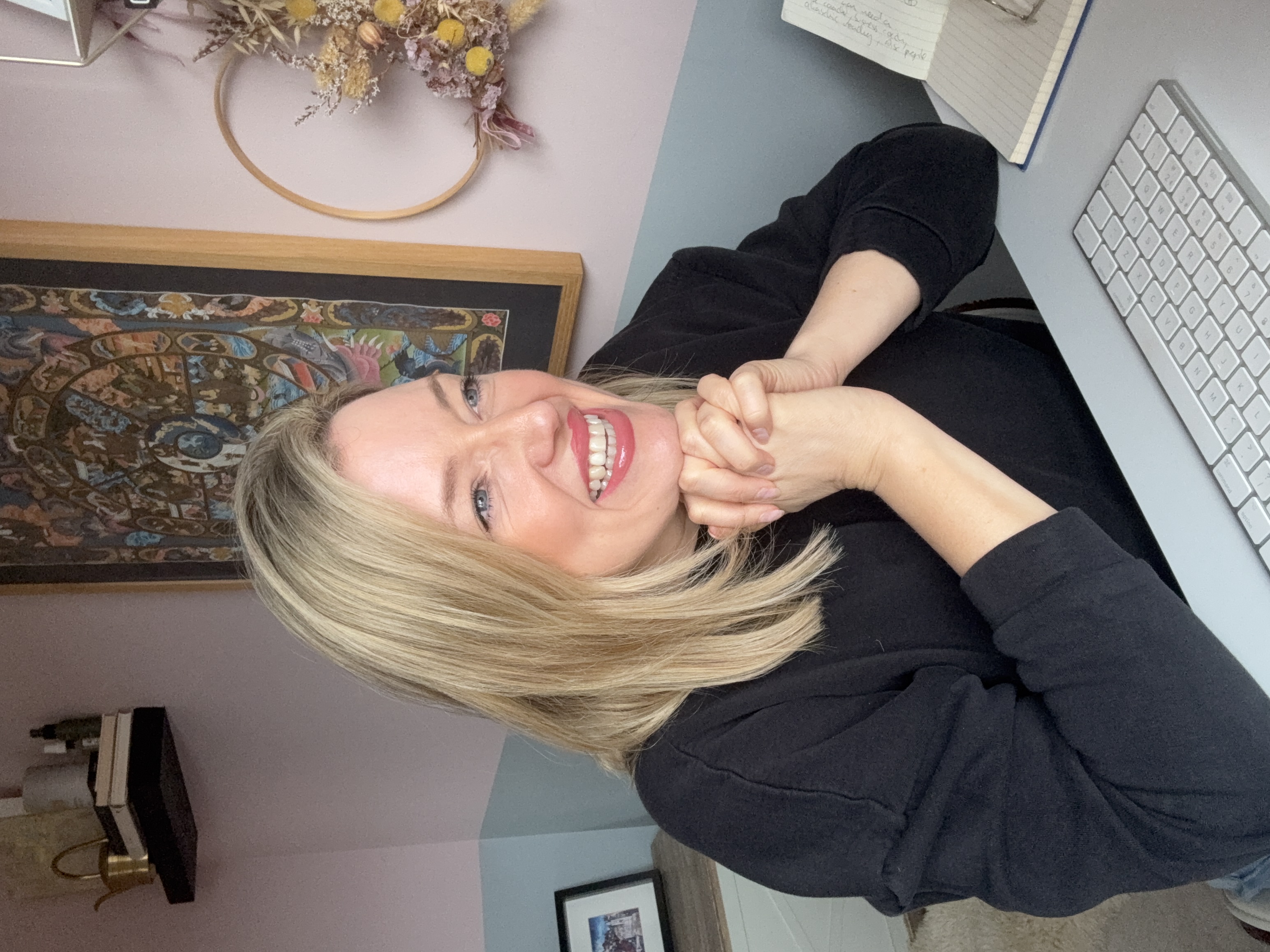 the roadblock coach sitting in front of a window thinking.