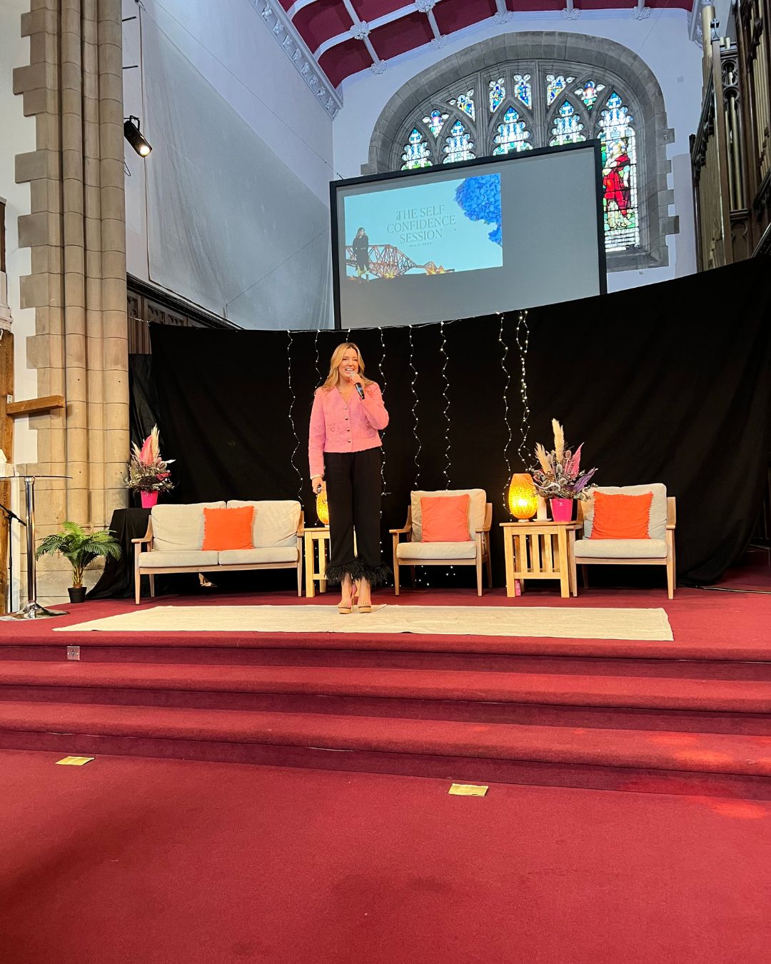 the roadblock coach sitting in front of a window thinking.