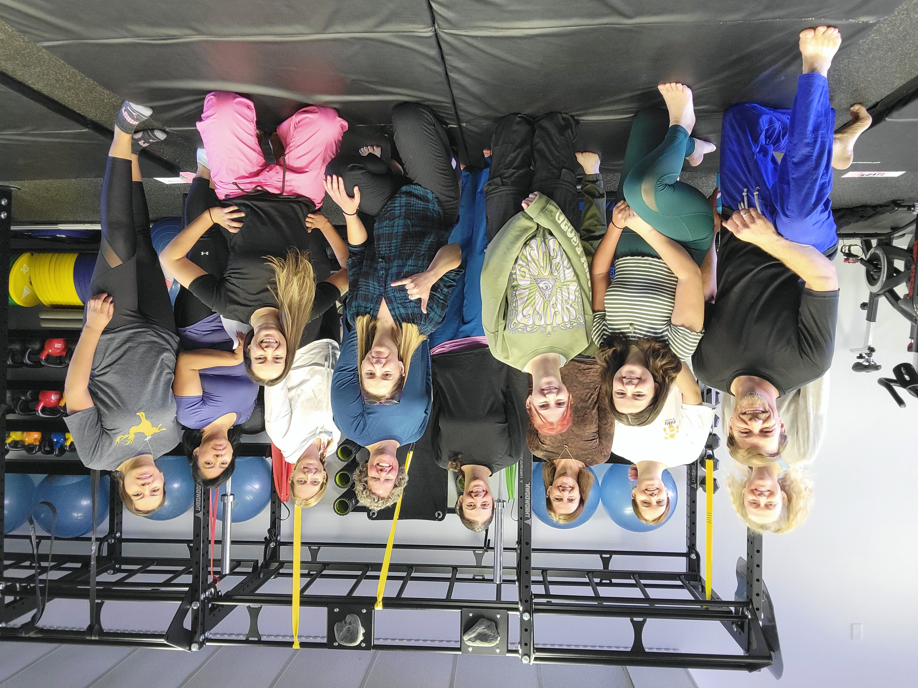 A graphic of 3 women in jiu-jitsu gis, smiling.