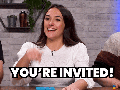 GIF of woman smiling looking at camera pointing with 'you're invited' written on the screen