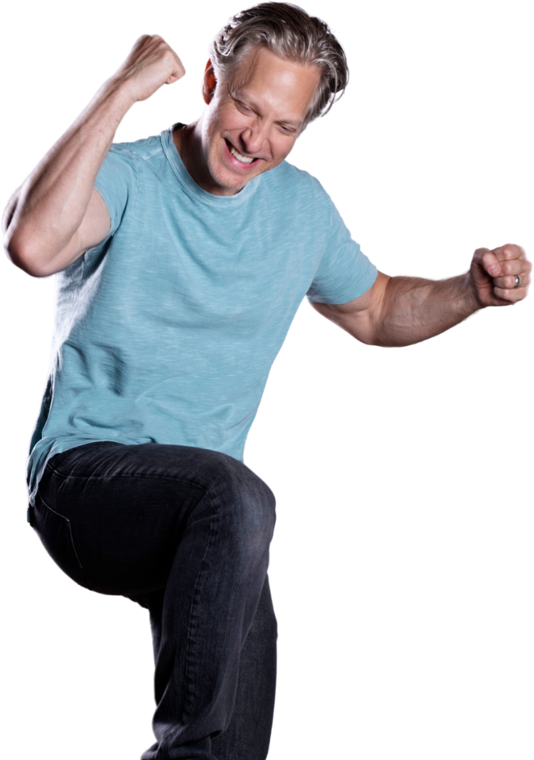 Randy Spelling jumping up pumping fist smiling with excitement 