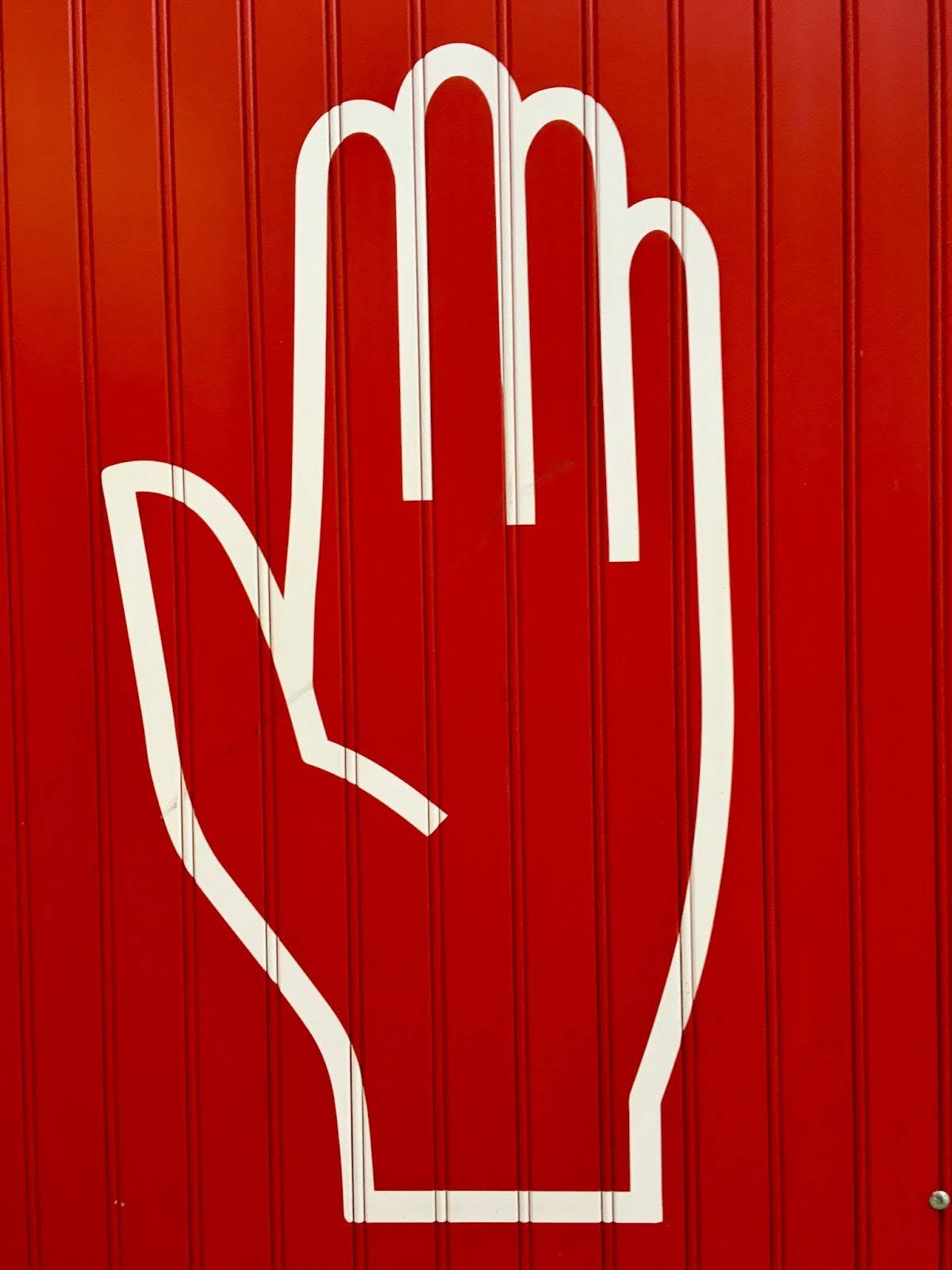 Hand drawing on red wall: assertive boundary setting