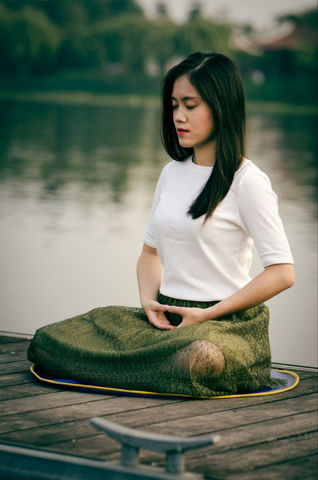 Woman meditating, symbolizing awareness, mindful practice of anger release 
