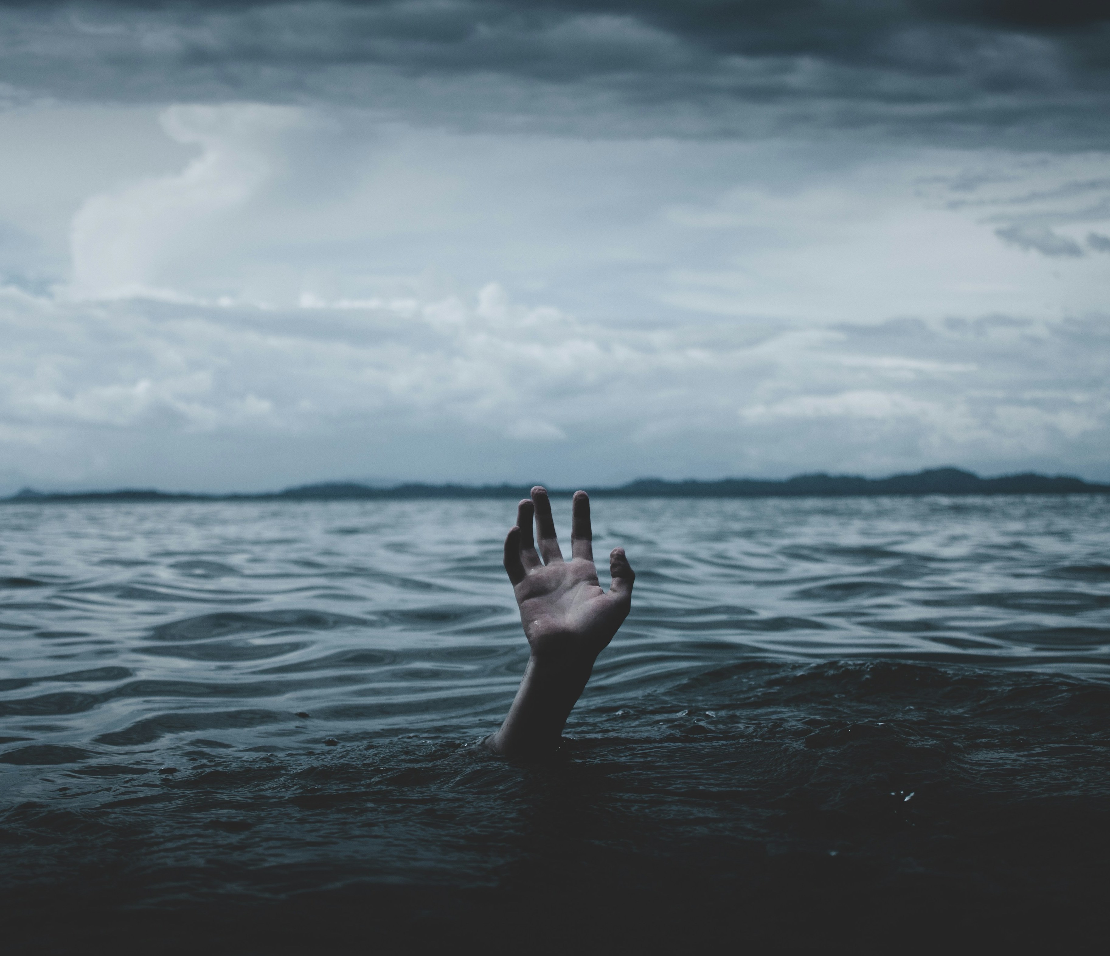 Hand in the sea, shows Loss of Identity, Burnout , anxiety and stress