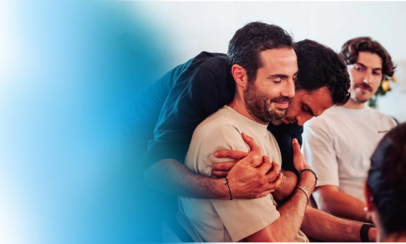 Deepdive participants experiencing breakthrough at healing retreat for personal growth.