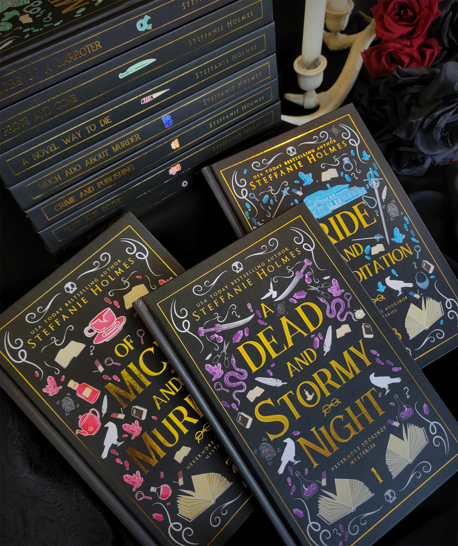 The first three books in the Nevermore Bookshop series on black covers with gold foil details and gilded edges.