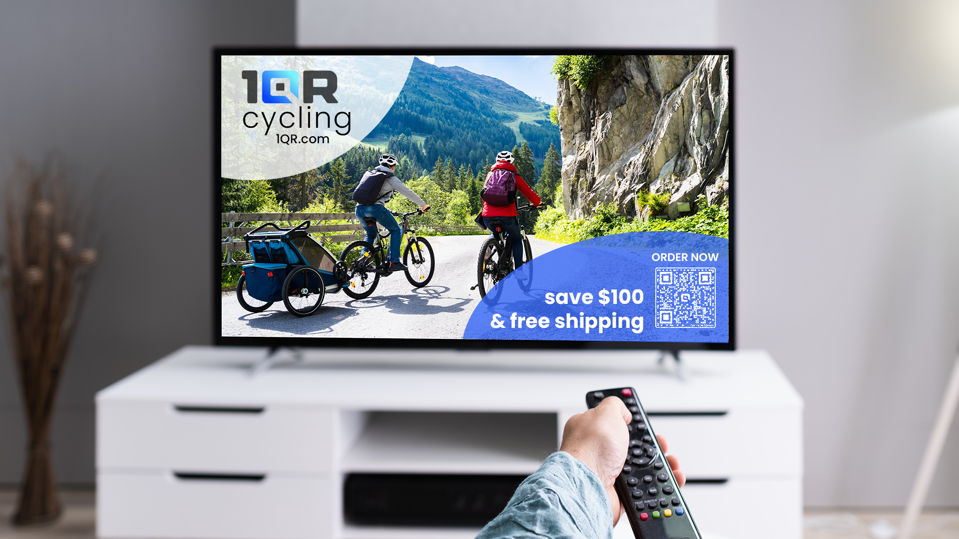 Television with mountain bike commercial that is using a QR code to promote online shopping and a specail offer