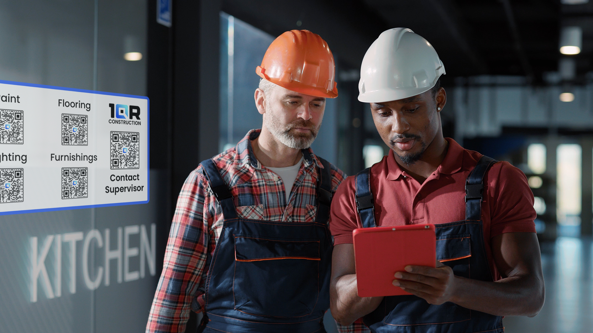 Two men in hard hats reviewing building plans on a tablet at a nearly finished construction site