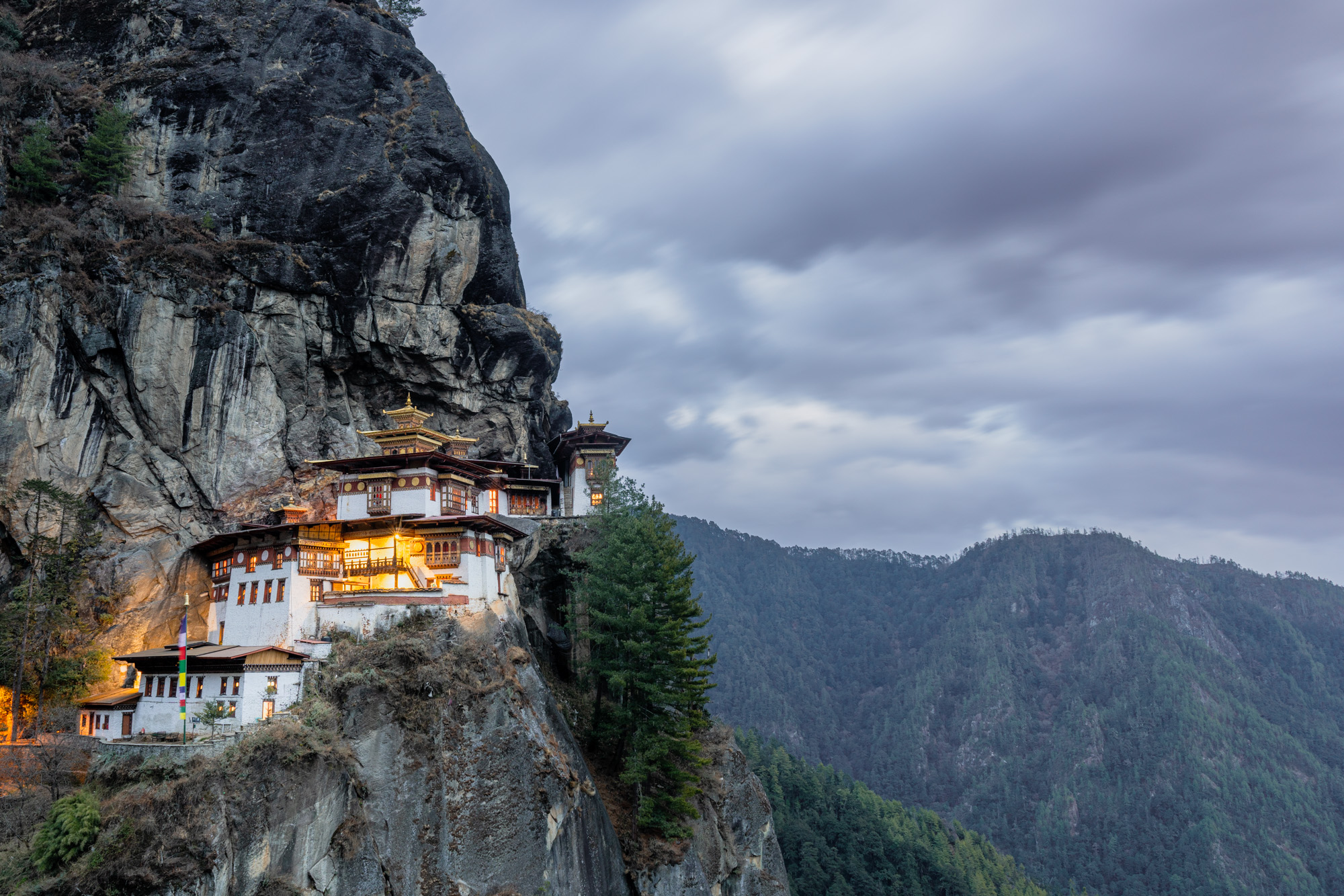 Iconic Tiger's Nest Monastery clinging to cliffside in Bhutan - Captured on a raw Tours adventure