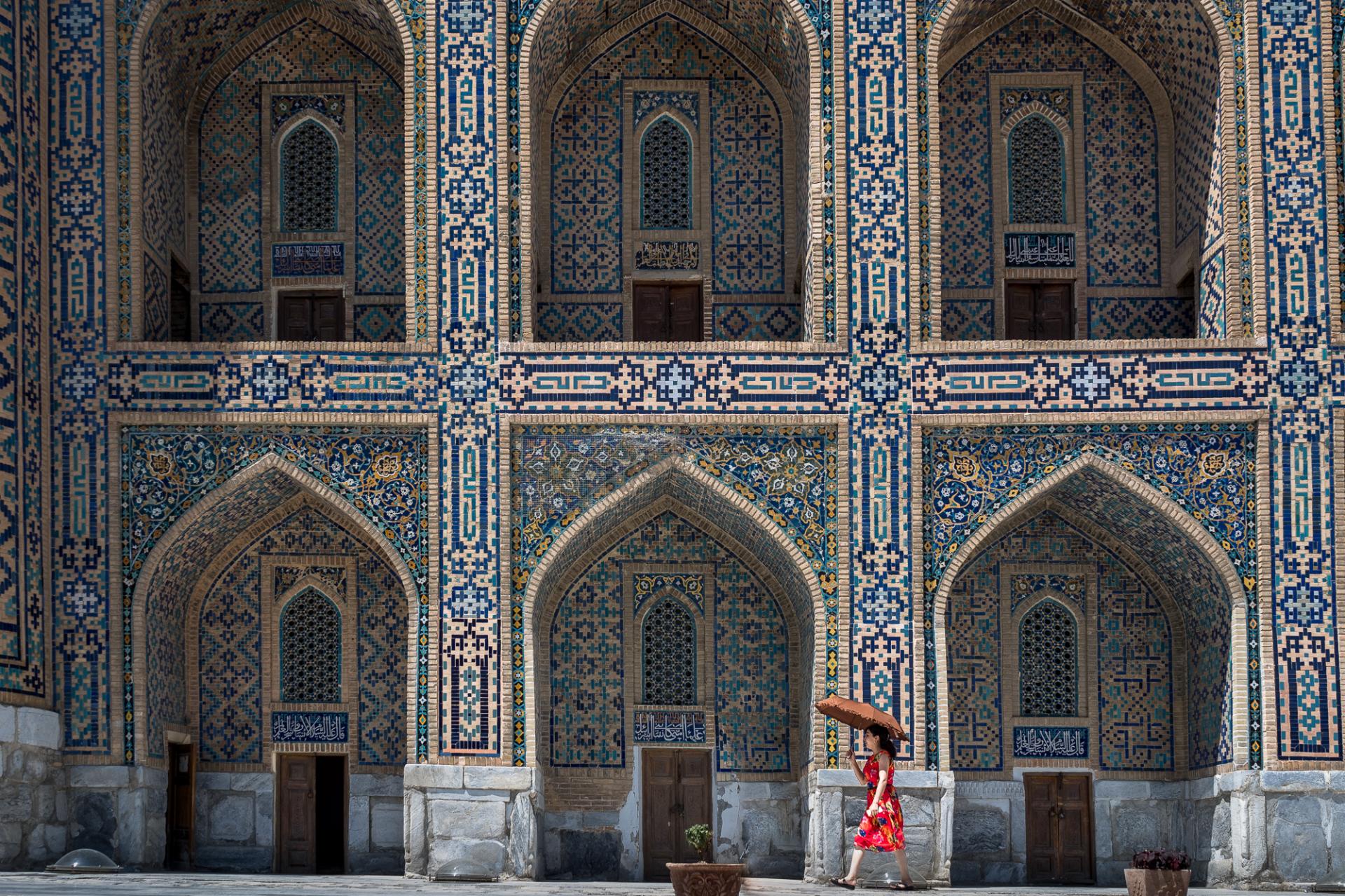 Intricate blue tilework of Silk Road architecture in Uzbekistan - explore with raw Tours.