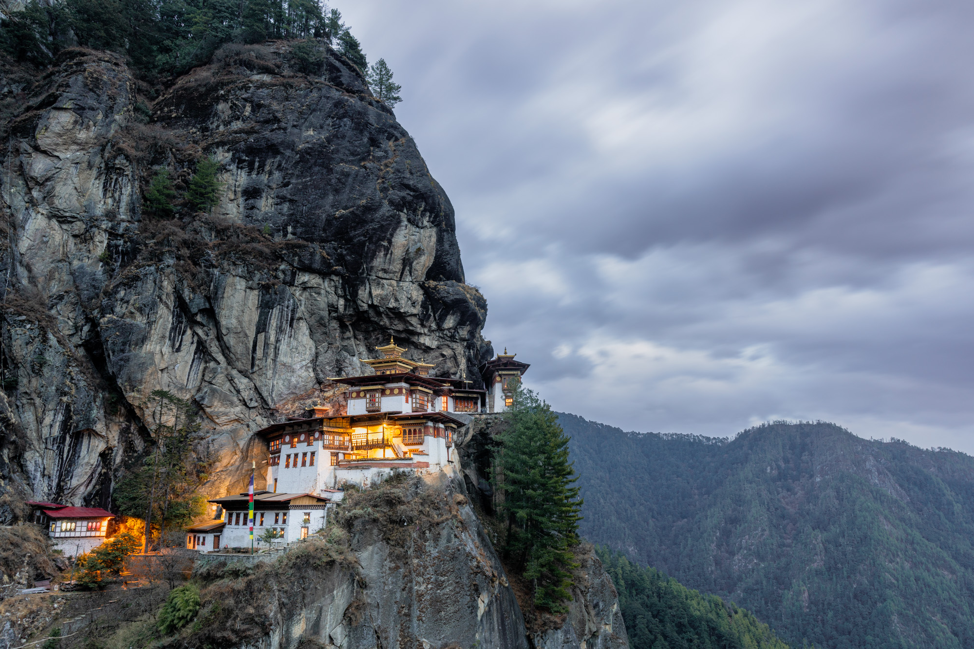 Iconic Tiger's Nest Monastery clinging to a Bhutan cliffside - Raw Tours destination.
