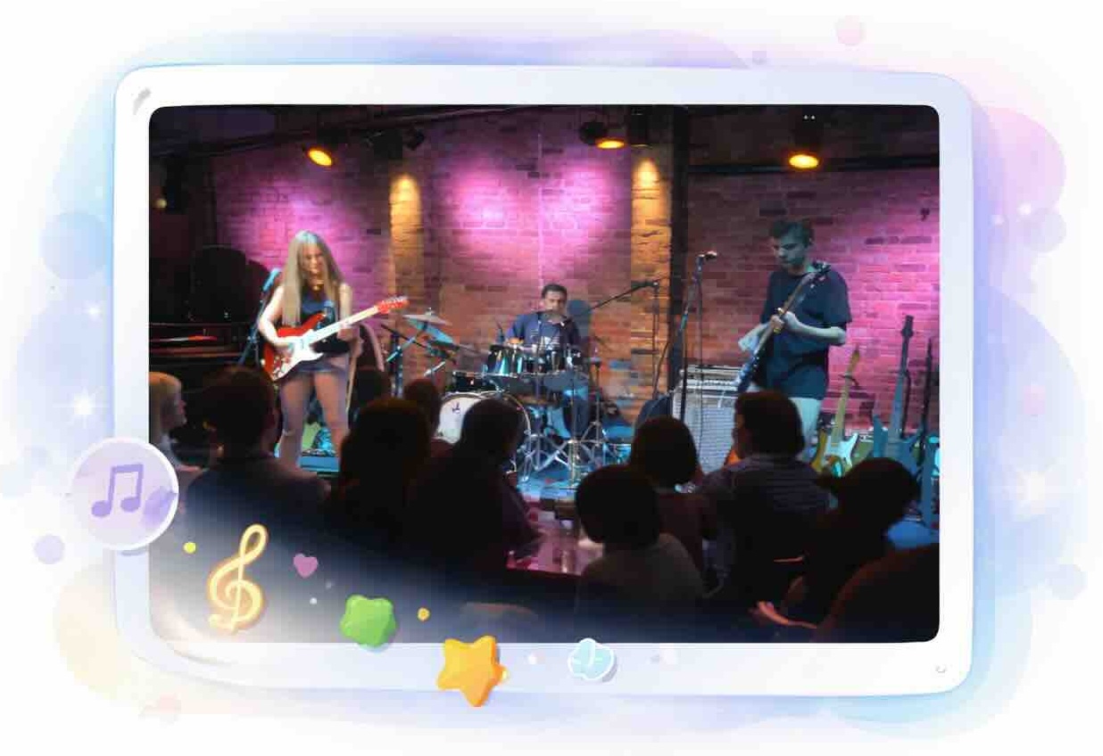 Real Brave guitar students performing live on stage at a Real Brave music school concert