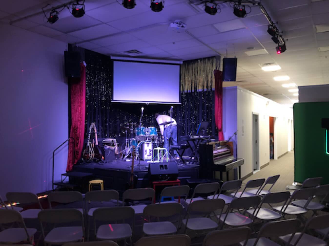 Performance stage and recital hall at Real Brave Oakland NJ offering guitar, bass, drum, vocal and piano lessons