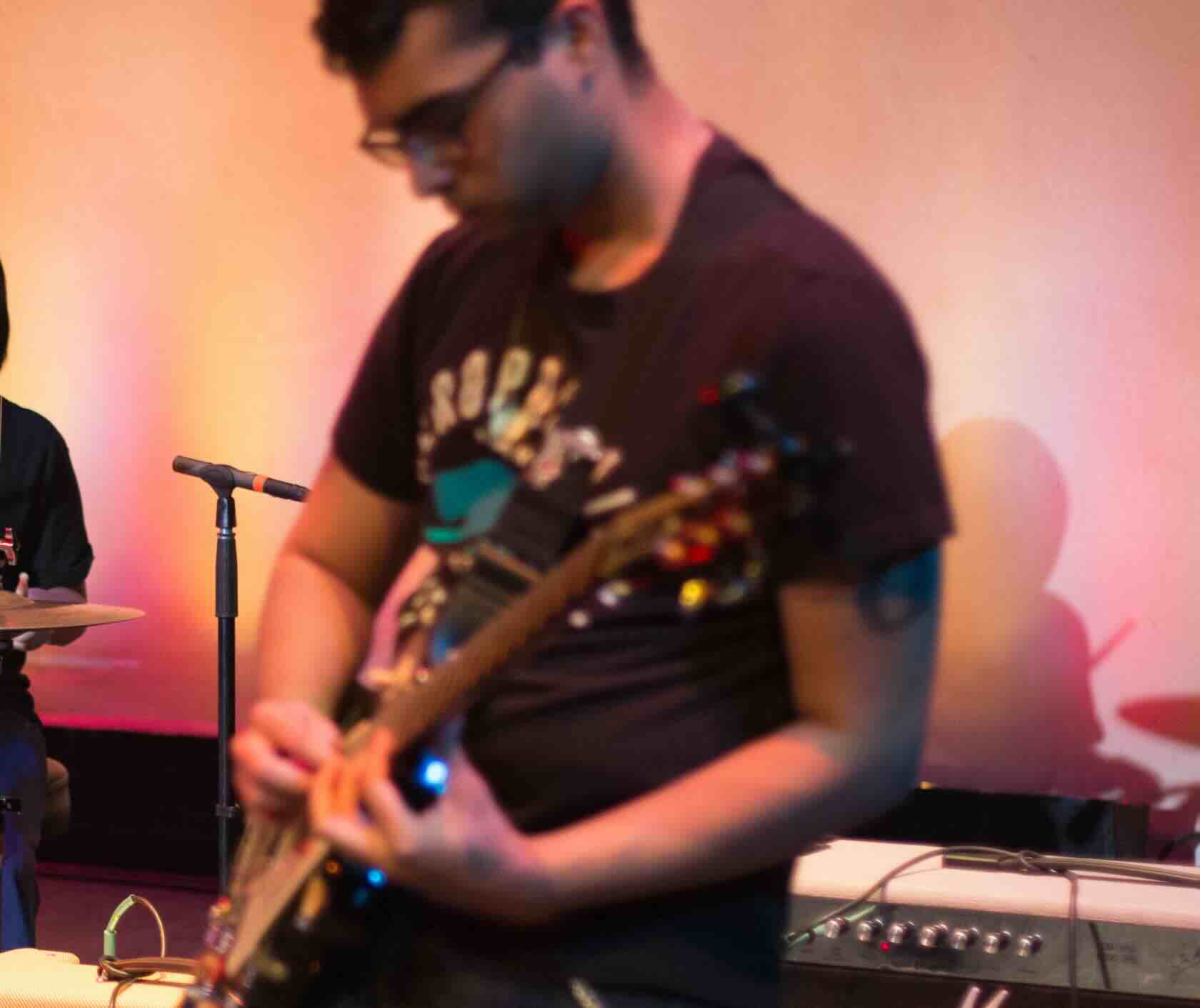 Beginner guitar student learning guitar during private lesson at Real Brave music school