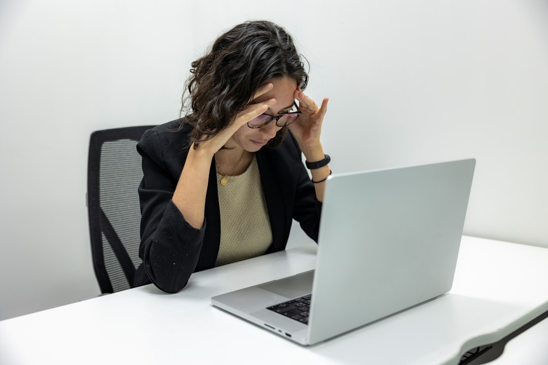 Woman holding her head, thinking showing her before listening to the fear of public speaking and online visibility energy act