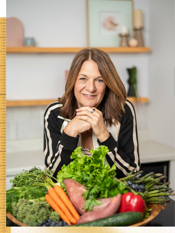 Dr. Brewer with bowl of fresh vegetables