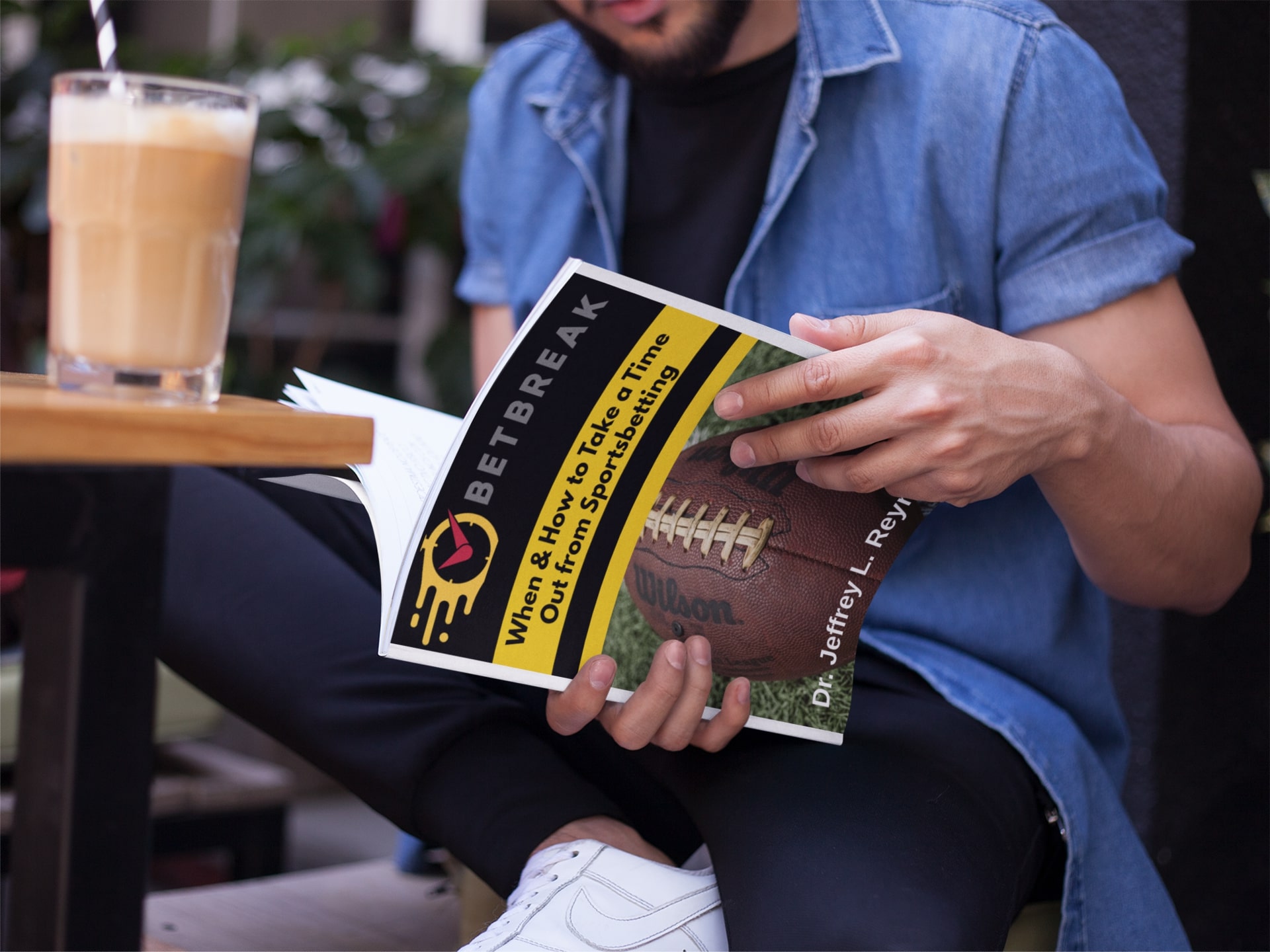 young man reading BetBreak's guide to problem gambling