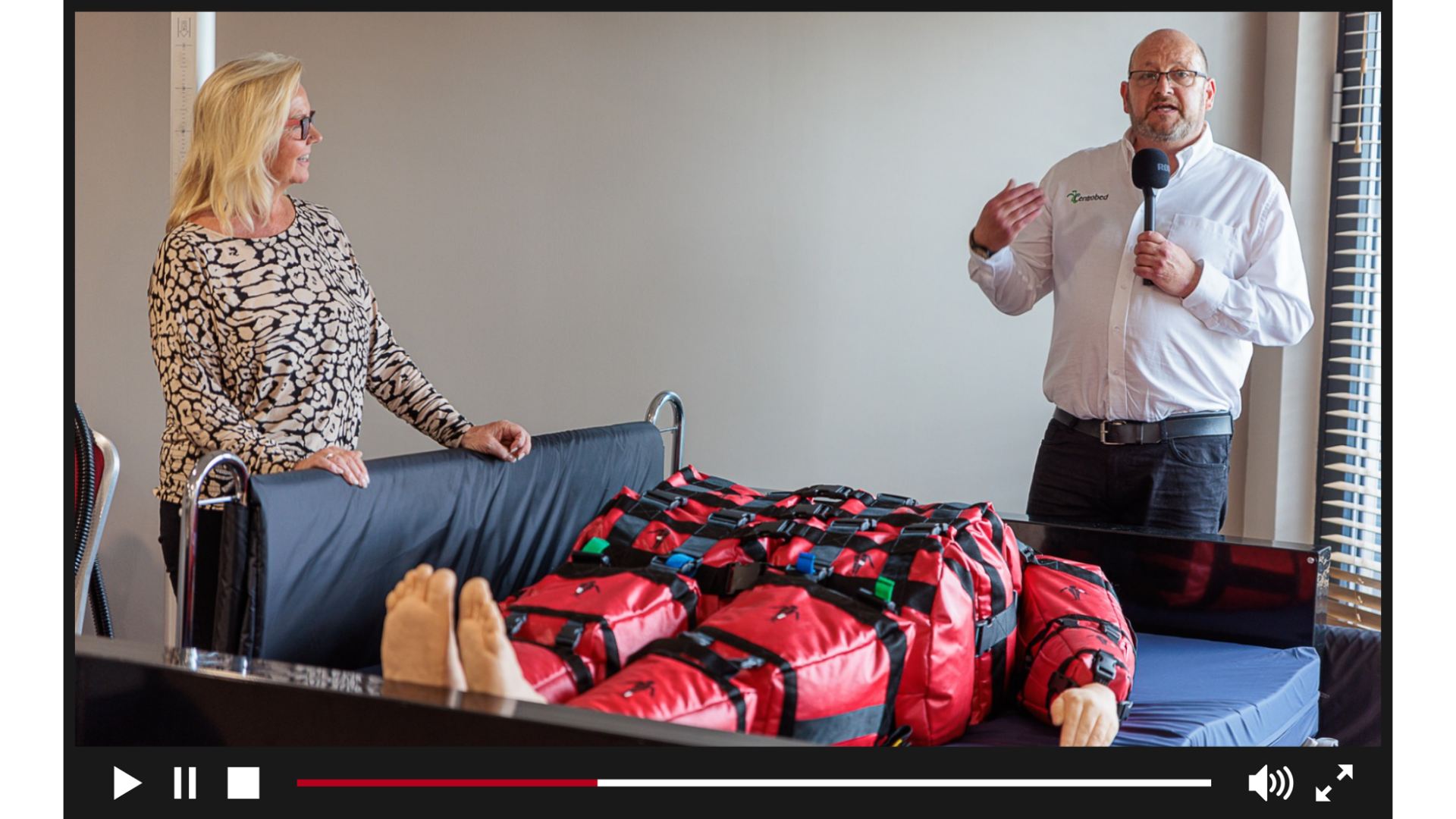 A sleeping moving and handling training session within a video playback box
