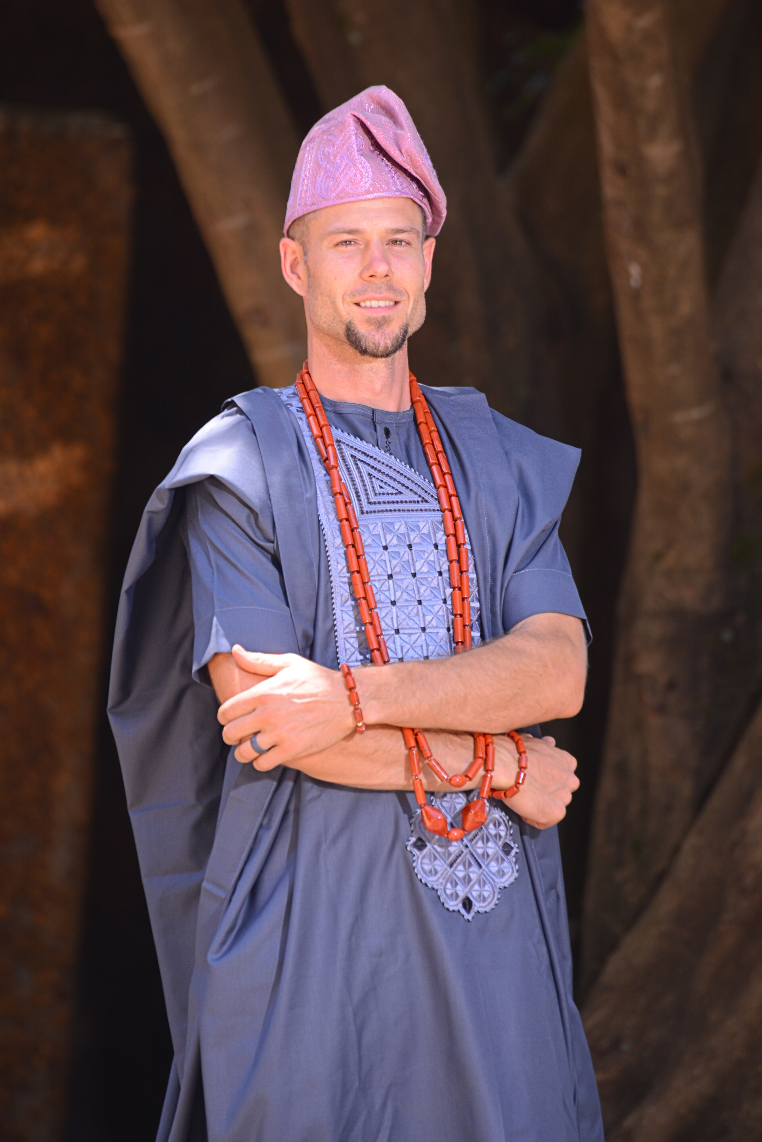 Portrait of Pablo wearing traditional Yoruba attire, fila, beads, agbada, etc.
