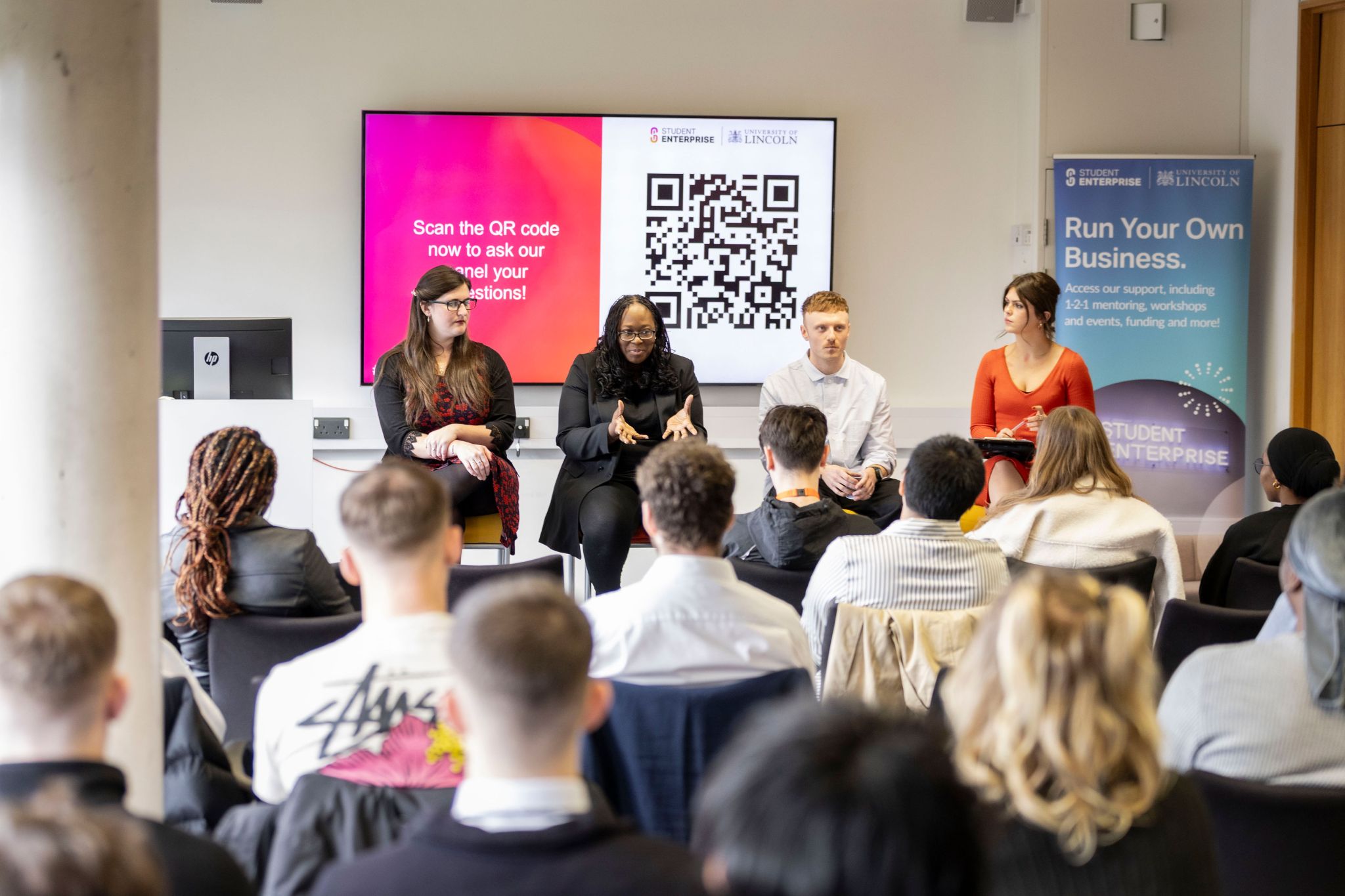 Eleanor Bryan on an expert panel at a business conference.