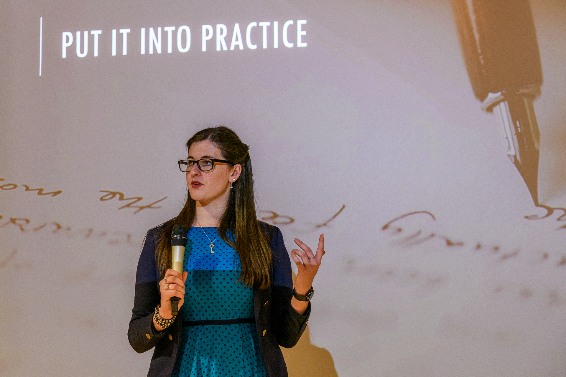 Eleanor Bryan of Arcanum Academy delivering a presentation on copywriting.