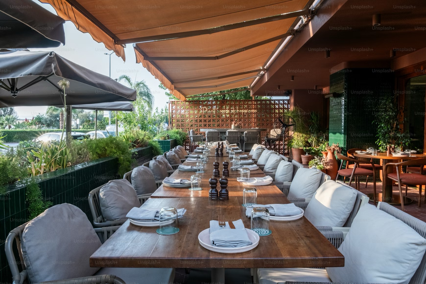 Long table with many empty seats / chairs