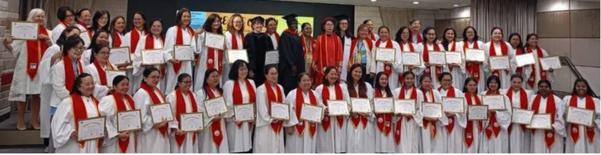 A picture of Uptick Global: ABWU 2024-2025 graduates. They are holding their certificates of completion. 