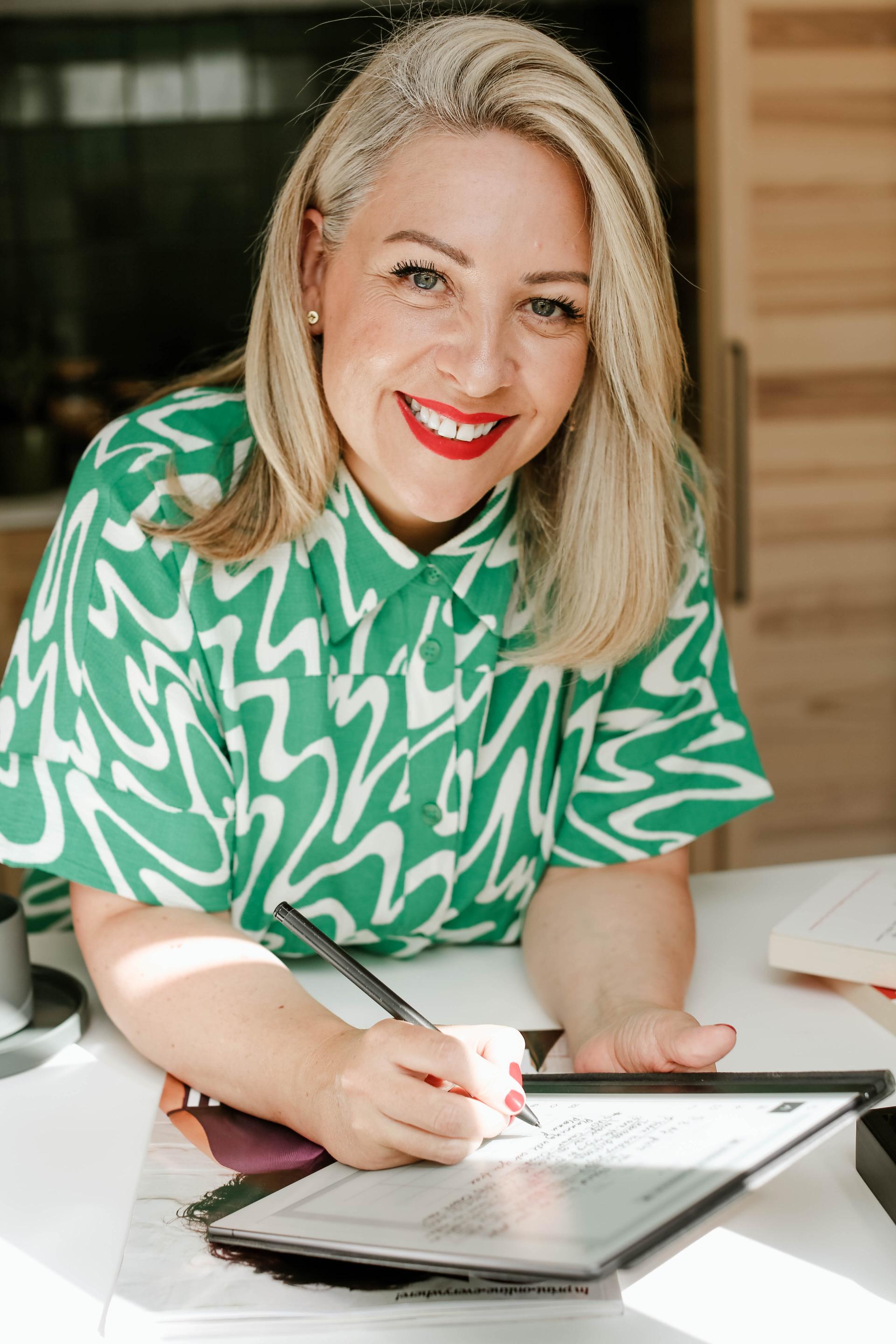 hair salon marketer Vivienne Johns smiling and working